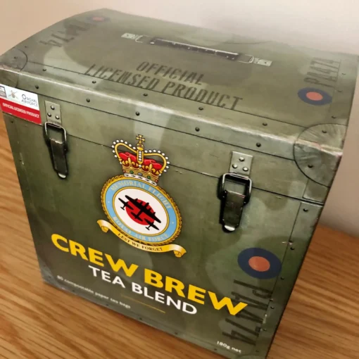 A BBMF Crew Brew Tea Blend Box - 80 Compostable Paper Tea Bags sits on a table.
