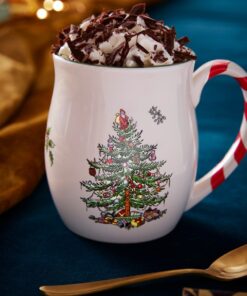 A Wrendale Designs Christmas Tree Mug & Coaster sits on a table.